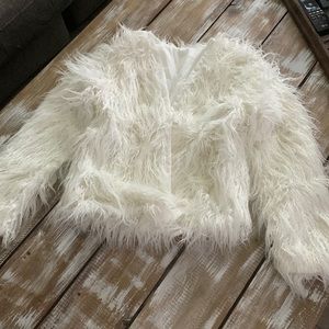 White faux fur coat
